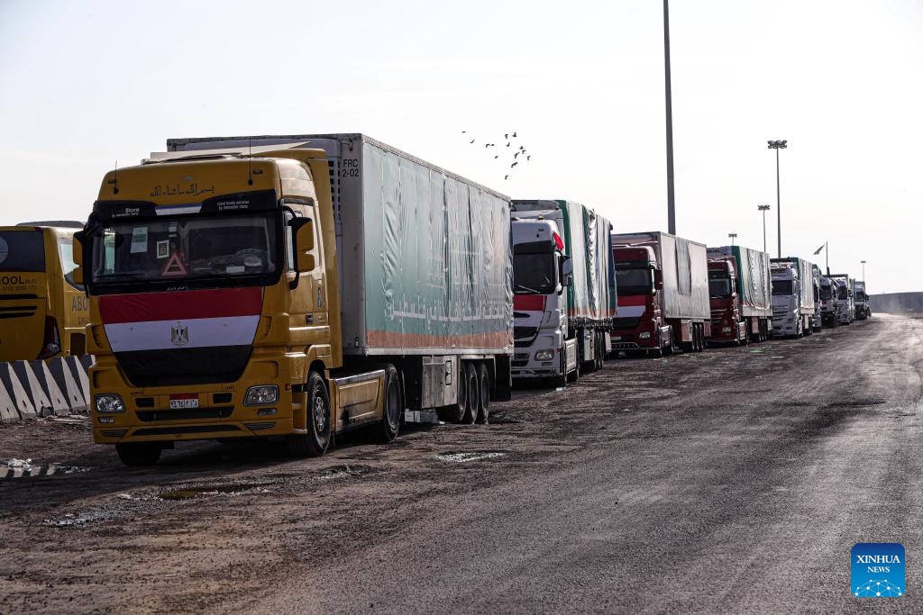 Trucks carrying relief aid line up to enter Gaza near the Egyptian side of the Rafah crossing, on Oct. 31, 2023. Hundreds of trucks carrying relief aid have waited for days at the Egyptian side of the Rafah crossing to enter the war-torn Gaza Strip, home to 2.3 million Palestinians who have been deprived of fuel, food, water and medical supplies for nearly three weeks under Israeli blockades.(Photo: Xinhua)