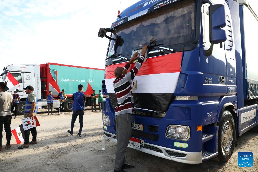 Trucks carrying relief aid line up to enter Gaza near the Egyptian side of the Rafah crossing, on Oct. 31, 2023. Hundreds of trucks carrying relief aid have waited for days at the Egyptian side of the Rafah crossing to enter the war-torn Gaza Strip, home to 2.3 million Palestinians who have been deprived of fuel, food, water and medical supplies for nearly three weeks under Israeli blockades.(Photo: Xinhua)
