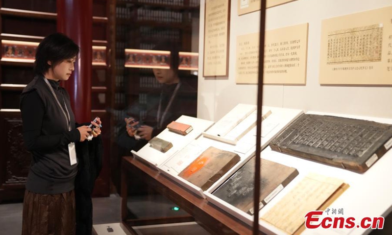 Traditional printing woodblock relics are displayed at the Palace Museum in Beijing, Oct. 30, 2023. (Photo: ecns.cn)