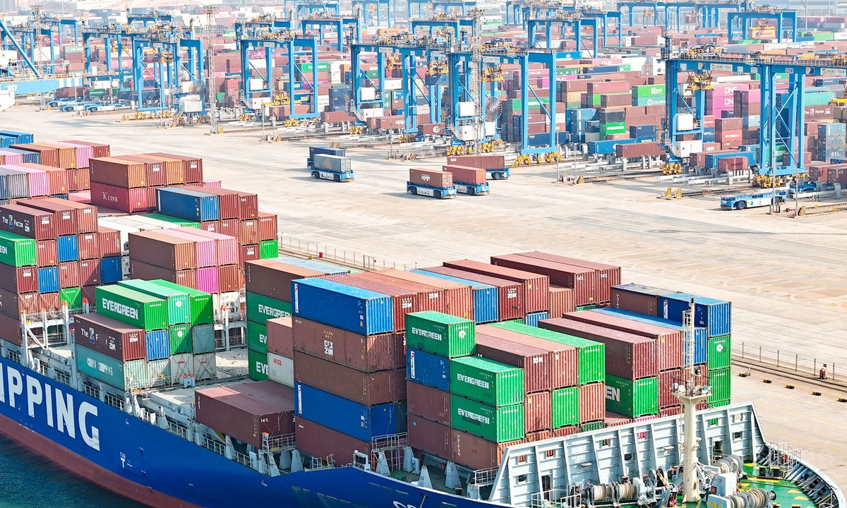 A cargo ship called Cosco Ashdod docks at an automated port in Qingdao, East China's Shandong Province on November 1, 2023. The port operates many services to the countries and regions participating in the Belt and Road Initiative. The customs-clearing efficiency of the ship has improved by 10.8 percent thanks to the implementation of multiple smart measures. Photo: VCG