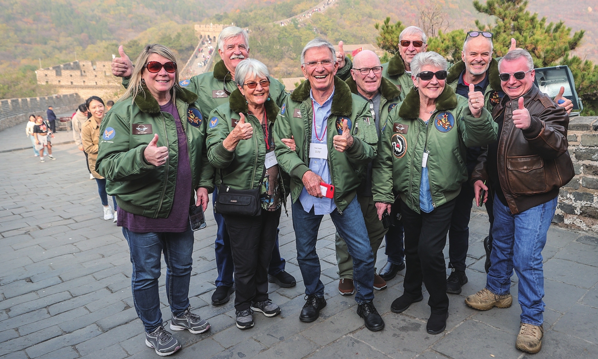 Families of the Flying Tigers pose on the Great Wall in Beijing on October 29, 2023. Photo: VCG 
