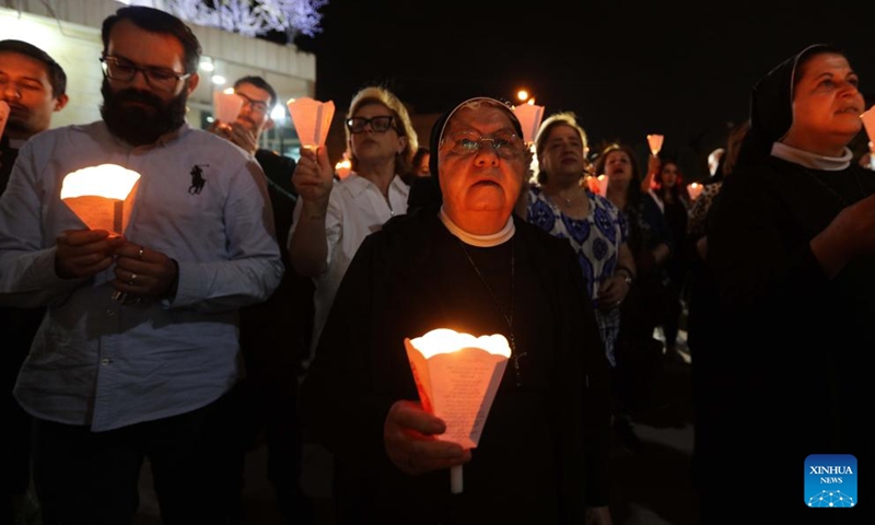 People offer prayers during a candlelight vigil in support of Palestinians in Amman, Jordan, on Oct. 31, 2023.(Photo: Xinhua)