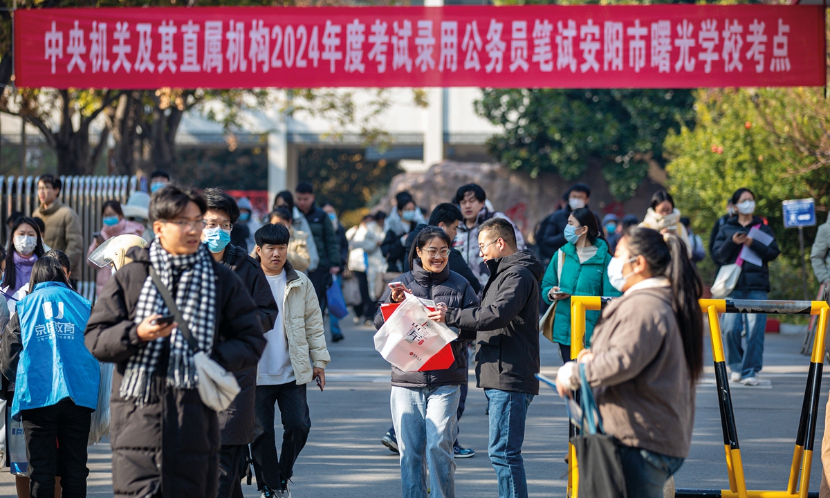 Candidates taking part in the annual national public servant exams walk out of an examination room in Anyang, Central China's Henan Province, on November 26, 2023. Photo: VCG