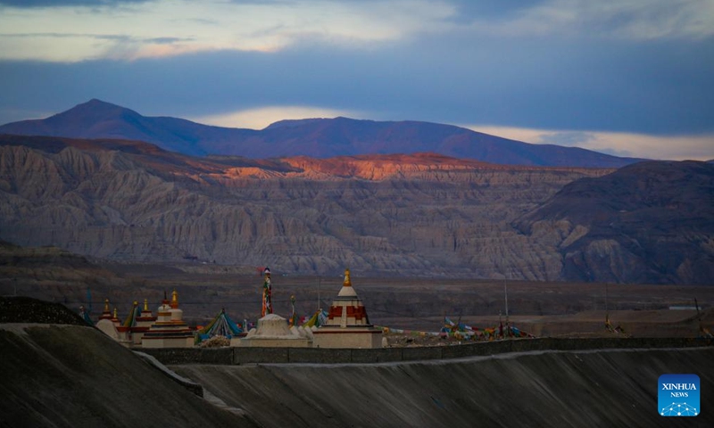 This photo taken on Nov. 3, 2023 shows the landscape of earth forest during dawn in Zanda County of Ngari Prefecture, southwest China's Tibet Autonomous Region. Zanda is famous for the unique landscape of earth forest. With gullies, ravines and steep mountainsides, the unique landscape was shaped as a result of gradual geological movements of the Himalayan region ever since the Quaternary Period from 2.5 million years ago and the impact of perennial water erosion and airslaking. (Photo: Xinhua)