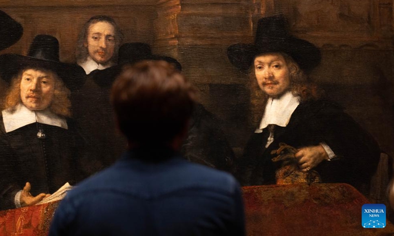 A visitor views an artwork at the Rijks museum during the Museum Night event in Amsterdam, the Netherlands, Nov. 4, 2023. The Museum Night is an annual event which allows people to visit Amsterdam's museums at night. (Photo: Xinhua)