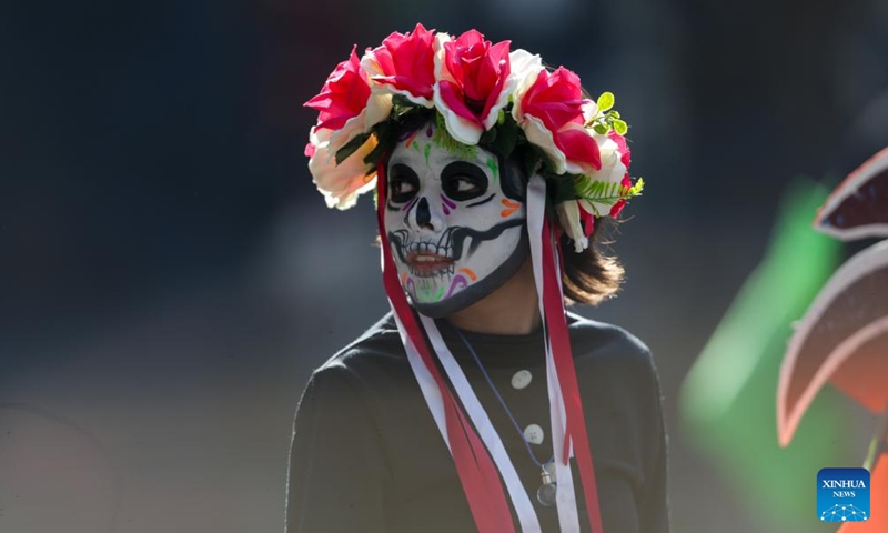 People take part in the Day of the Dead Parade in downtown Mexico City, capital of Mexico, on Nov. 4, 2023. (Photo: Xinhua)