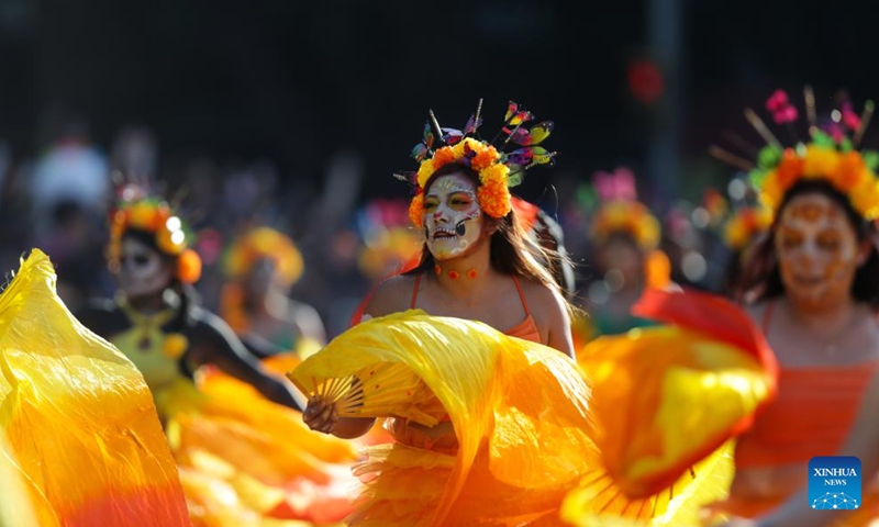 People take part in the Day of the Dead Parade in downtown Mexico City, capital of Mexico, on Nov. 4, 2023. (Photo: Xinhua)