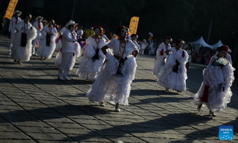 People take part in the Day of the Dead Parade in downtown Mexico City, capital of Mexico, on Nov. 4, 2023. (Photo: Xinhua)