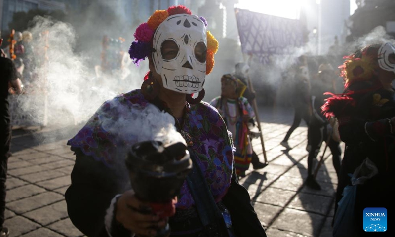 People take part in the Day of the Dead Parade in downtown Mexico City, capital of Mexico, on Nov. 4, 2023. (Photo: Xinhua)