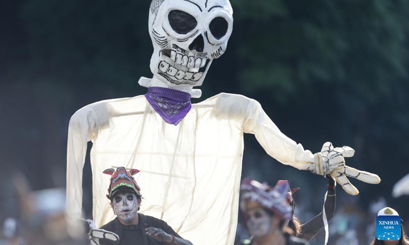 People take part in the Day of the Dead Parade in downtown Mexico City, capital of Mexico, on Nov. 4, 2023. (Photo: Xinhua)
