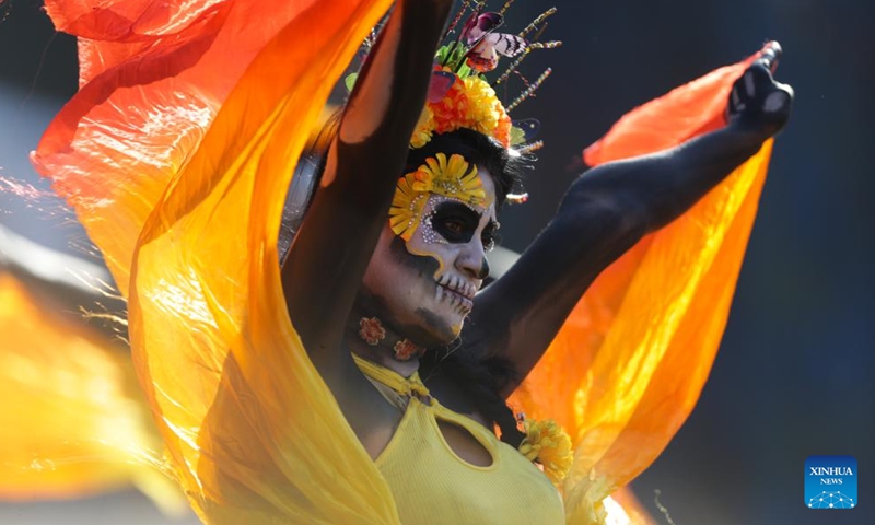 People take part in the Day of the Dead Parade in downtown Mexico City, capital of Mexico, on Nov. 4, 2023. (Photo: Xinhua)