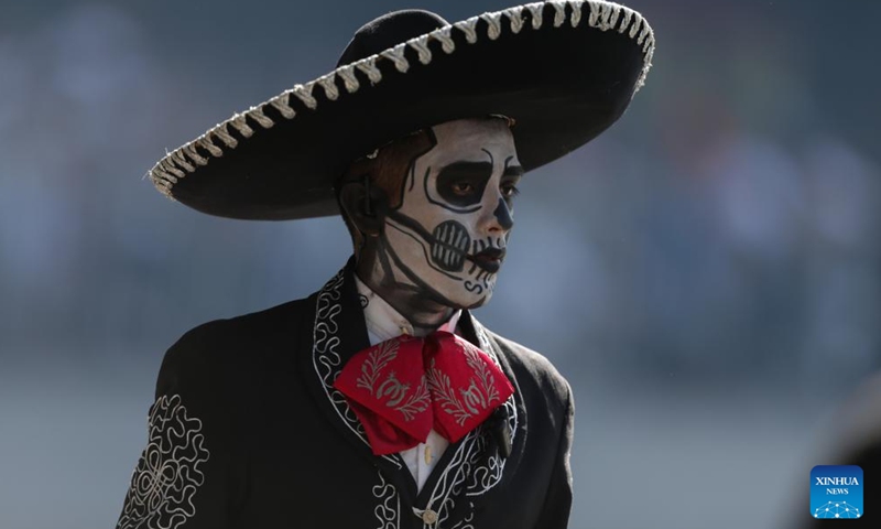 People take part in the Day of the Dead Parade in downtown Mexico City, capital of Mexico, on Nov. 4, 2023. (Photo: Xinhua)