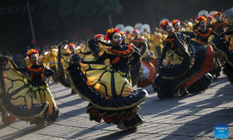 People take part in the Day of the Dead Parade in downtown Mexico City, capital of Mexico, on Nov. 4, 2023. (Photo: Xinhua)