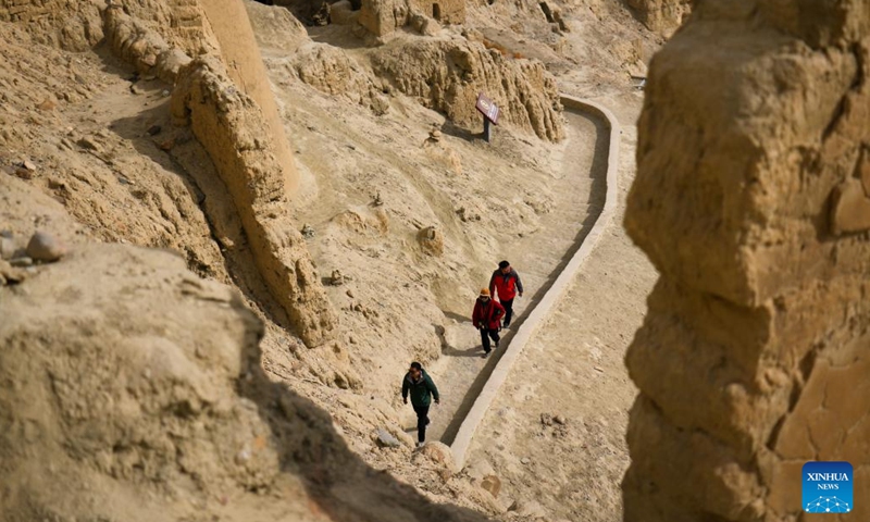 People visit the ruins of the Guge Kingdom in Zanda County of Ngari Prefecture, southwest China's Tibet Autonomous Region, Nov. 3, 2023. The ancient Guge Kingdom was probably founded in the 10th century but it was abandoned by the end of the 17th century. Only the mud-and-rock structures remained, sheltering their relics and wall paintings from the elements. (Photo: Xinhua)