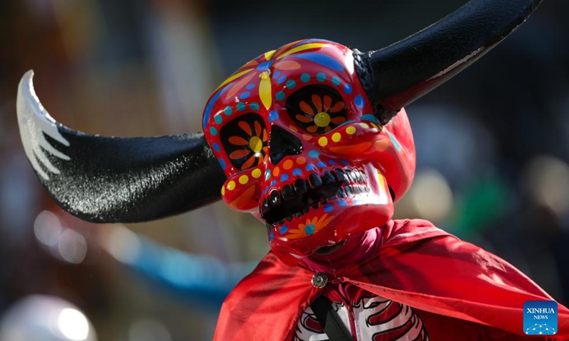 People take part in the Day of the Dead Parade in downtown Mexico City, capital of Mexico, on Nov. 4, 2023. (Photo: Xinhua)