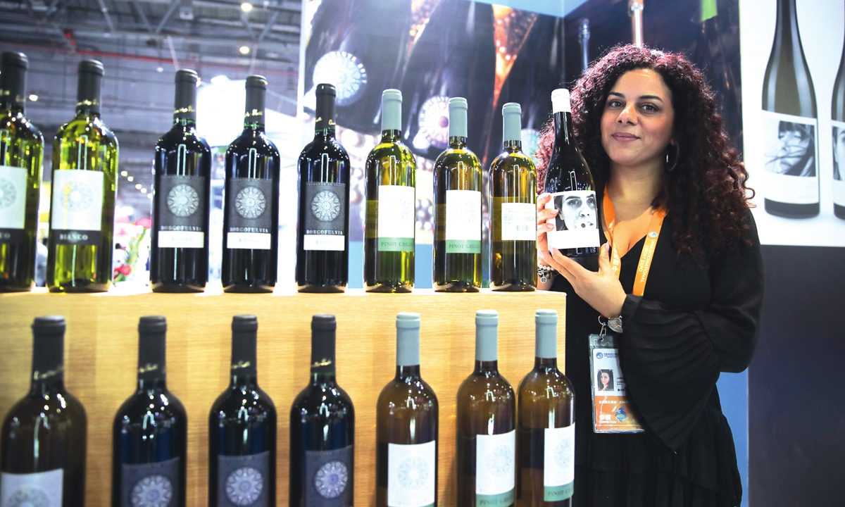 An exhibitor displays wine produced in Italy at the sixth China International Import Expo held in Shanghai on November 7, 2023. Photo: cnsphoto
