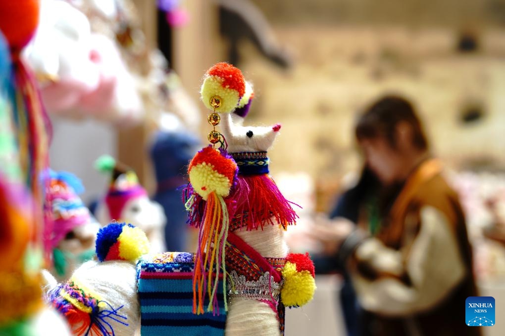 This photo taken on Nov. 6, 2023 shows a handicraft toy from Peru at the 6th China International Import Expo (CIIE) in east China's Shanghai. Besides business opportunities, the ongoing expo in Shanghai also provides a stage for exhibitors from different countries and regions to showcase their unique culture to the world.(Photo: Xinhua)