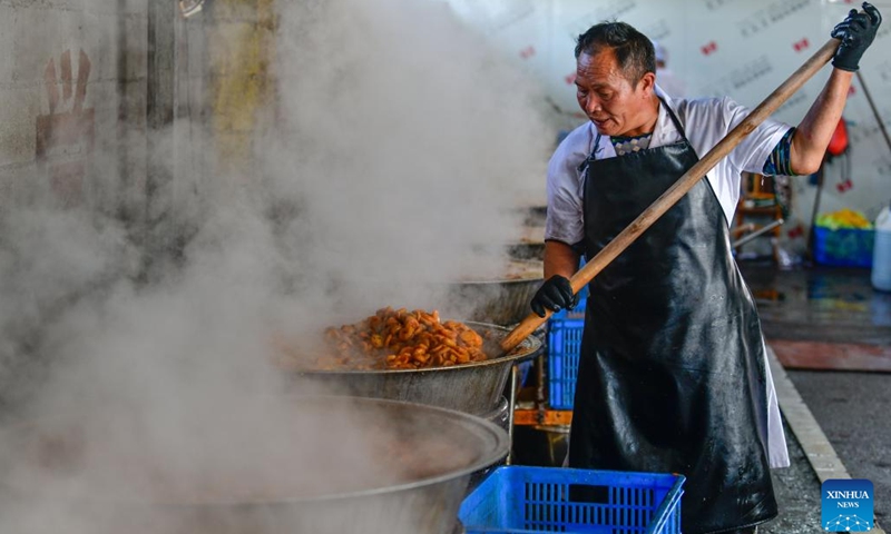 A worker makes preserved Cili fruit in Gujiao Town of Longli County, southwest China's Guizhou Province, Sept. 1, 2023. (Photo: Xinhua)
