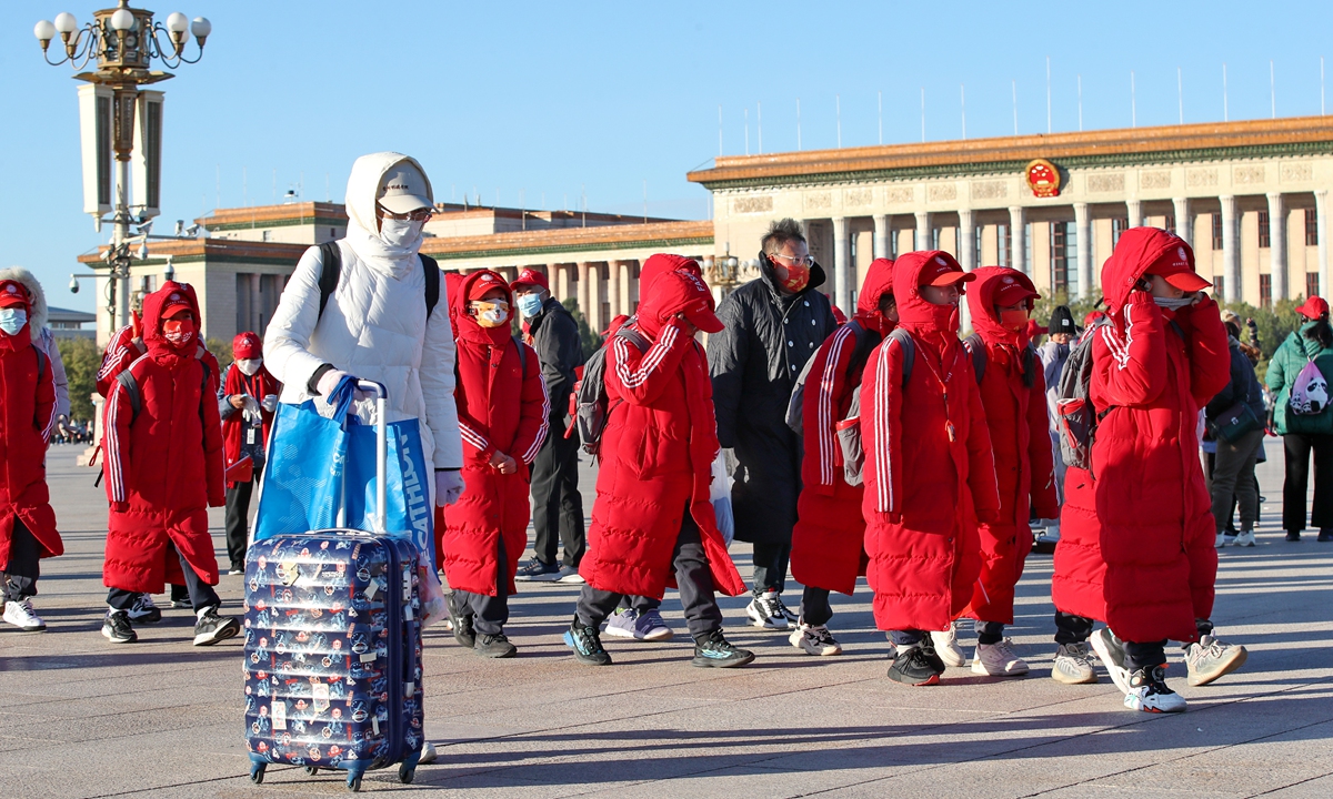 

Tourists wear thick winter clothes to visit Tian'anmen Square in the cold wind on November 12, 2023, as Beijing temperature stay low in recent days. Photo: VCG