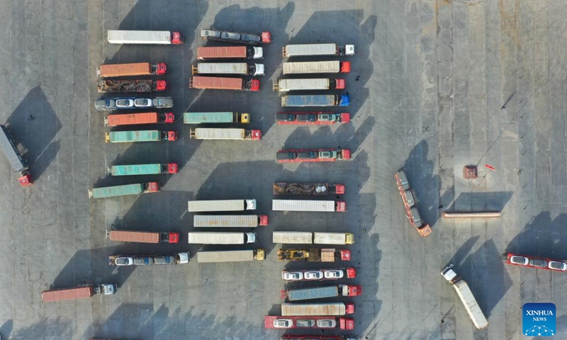 This aerial photo taken on Nov. 8, 2023 shows trucks parking at the Torugart port of northwest China's Xinjiang Uygur Autonomous Region. (Photo: Xinhua)