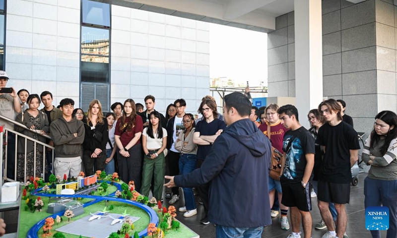 U.S. students participating in the China Education Tour learn about a trial line for a prototype locomotive using high-temperature superconducting (HTS) maglev technology in Chengdu, southwest China's Sichuan Province, Nov. 6, 2023. More than 20 young people from the United States participated in the China Education Tour in southwest China's Sichuan Province recently. (Photo: Xinhua)
