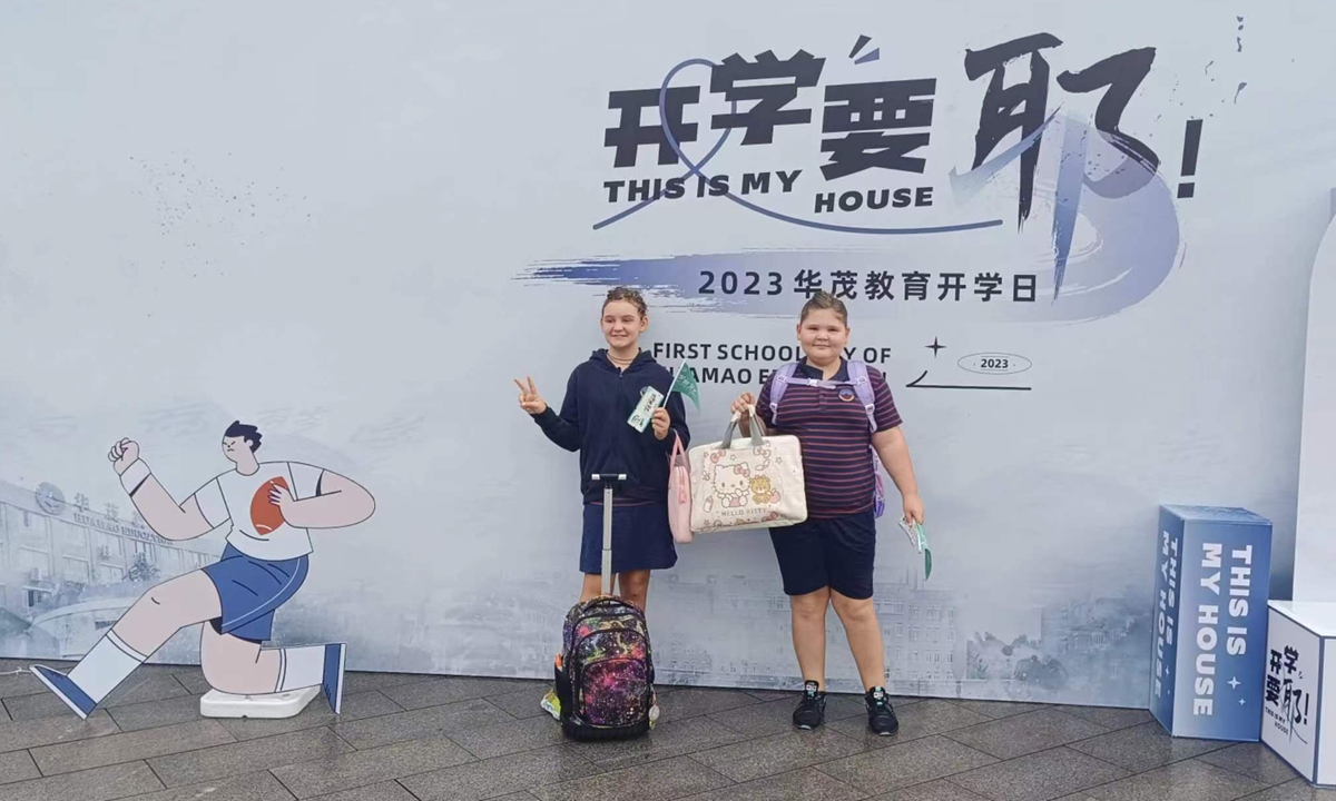 Roberts' two kids pose for a photo on the opening day of the new school year. Photo: Courtesy of Huamao Foreign Language School