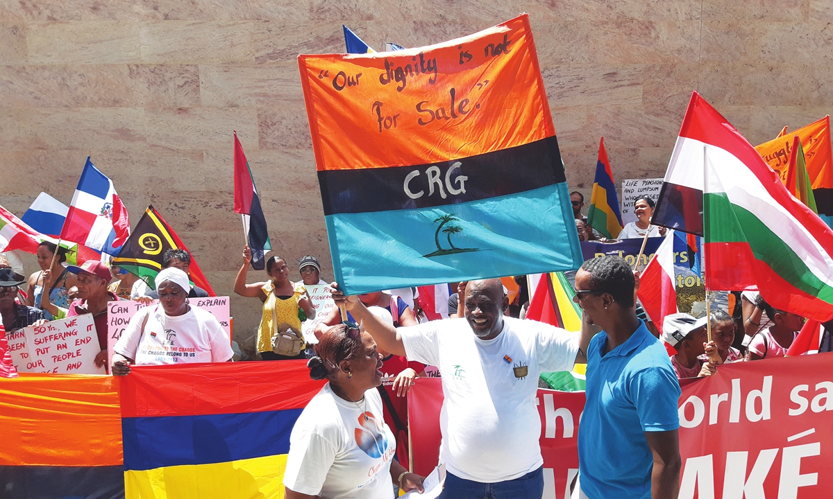 Demonstrators from the Chagos Islands protest at a British defiance of a United Nations deadline to end their 