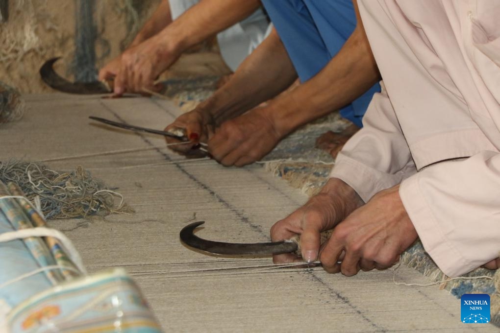 Workers make a carpet in Jawzjan Province, Afghanistan, Nov. 8, 2023.(Photo: Xinhua)