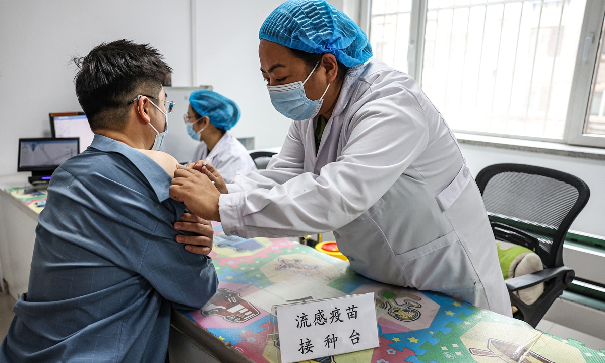 A resident receives a flu vaccine at a community health service center in Shenyang, Northeast China's Liaoning Province, on November 15, 2023. Respiratory diseases have progressed to their peak period of incidence across China, posing a threat to vulnerable groups such as children and the elderly. Photo: VCG