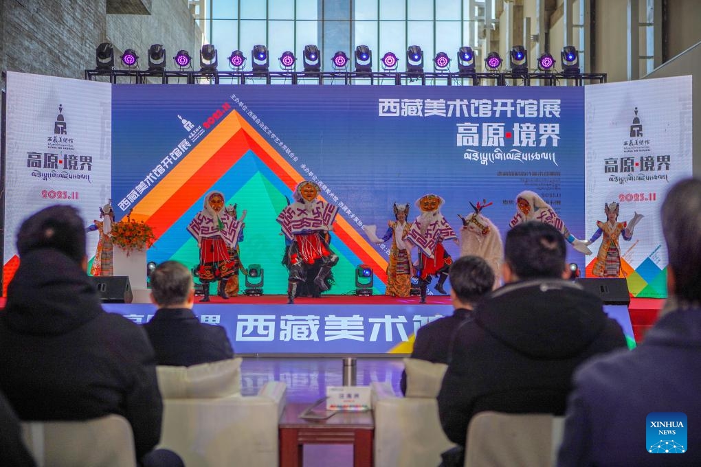 People enjoy a performance during an opening exhibition in the Xizang Art Museum in Lhasa, capital of southwest China's Xizang Autonomous Region, Nov. 15, 2023. A new art museum opened on Wednesday in Lhasa, exhibiting nearly 300 works by famous artists. With the design concept The Key to the Himalayas, the Xizang Art Museum is the first regional-level art museum in Xizang.(Photo: Xinhua)