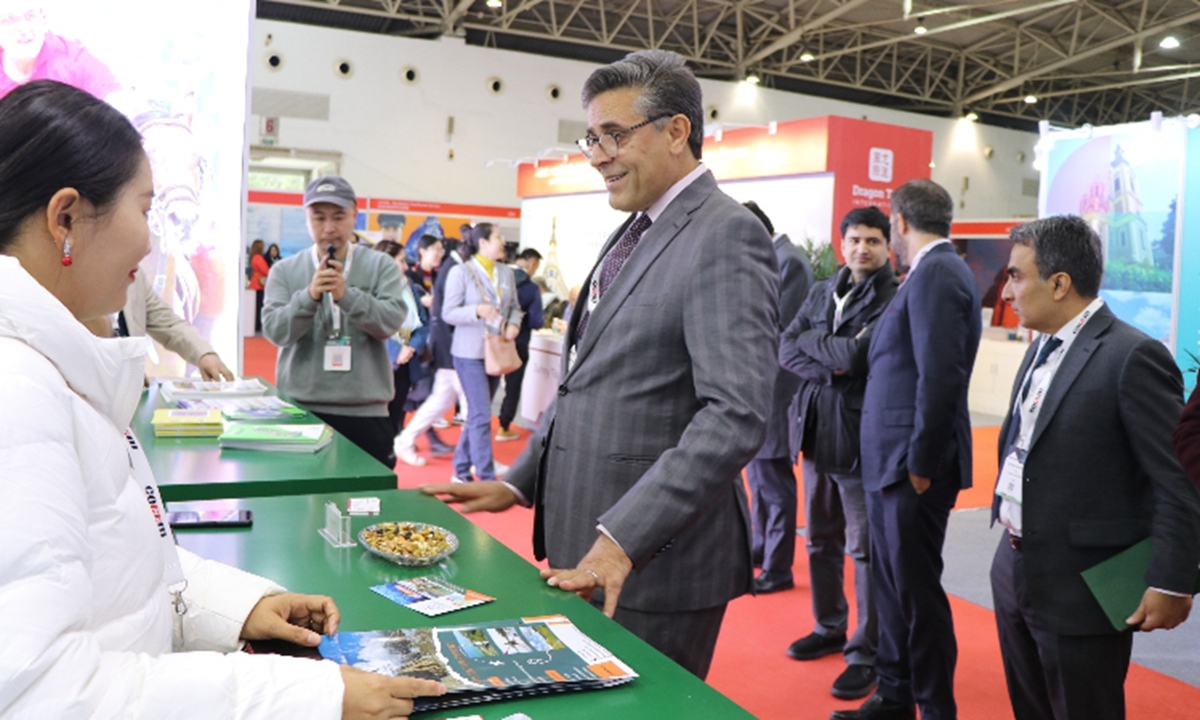 Ambassador Khalil Hashmi interacts with Pakistan's exhibitors  at Pakistan Pavilion at the China Outbound Travel and Tourism Market (COTTM) Expo,held at the China National Agriculture Center in Beijing on November 15,2023 