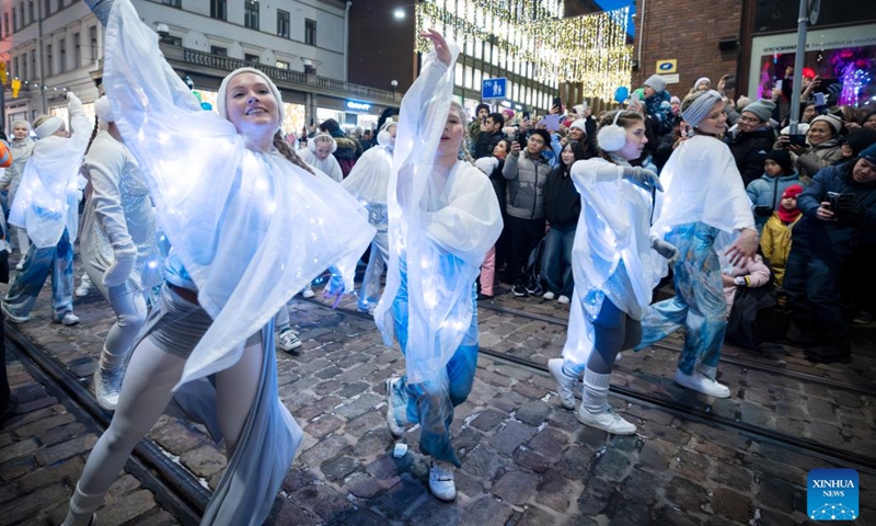 Artists perform during the Christmas opening celebration in Helsinki, Finland, Nov. 18, 2023. The Christmas opening celebration was held in central Helsinki on Saturday with a grand parade, marking the start of the festive season. (Photo: Xinhua)