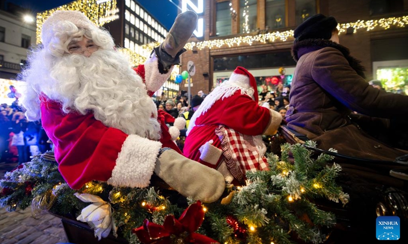 Actors dressed in Santa Claus costumes participate in the Christmas opening celebration in Helsinki, Finland, Nov. 18, 2023. The Christmas opening celebration was held in central Helsinki on Saturday with a grand parade, marking the start of the festive season. (Photo: Xinhua)