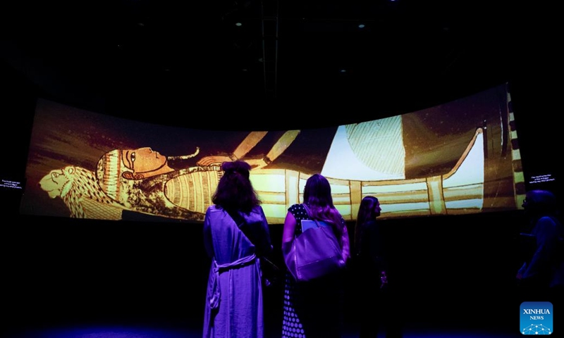 Journalists watch an introduction video at the media preview of the Ramses and the Gold of the Pharaohs exhibition in Sydney, Australia, on Nov. 16, 2023. (Photo: Xinhua)