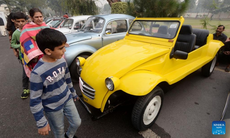 People visit a vintage and classic car show in Peshawar, Pakistan, Nov. 19, 2023. (Photo: Xinhua)
