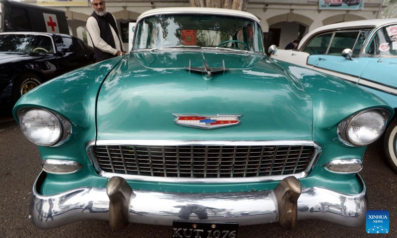 A man looks at a vehicle at a vintage and classic car show in Peshawar, Pakistan, Nov. 19, 2023. (Photo: Xinhua)

