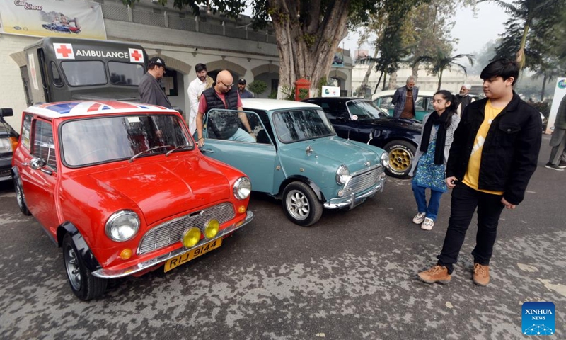 People visit a vintage and classic car show in Peshawar, Pakistan, Nov. 19, 2023. (Photo: Xinhua)
