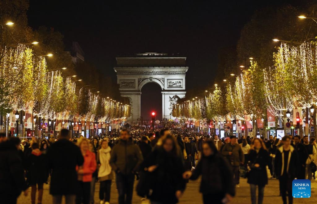 The Champs-Elysees Avenue is lit by Christmas season lights in Paris, France, Nov. 19, 2023. The annual Christmas season lighting ceremony was held here on Sunday.(Photo: Xinhua)