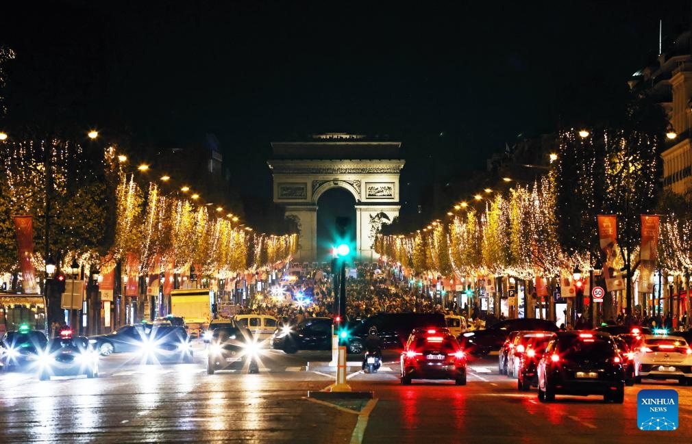 The Champs-Elysees Avenue is lit by Christmas season lights in Paris, France, Nov. 19, 2023. The annual Christmas season lighting ceremony was held here on Sunday.(Photo: Xinhua)