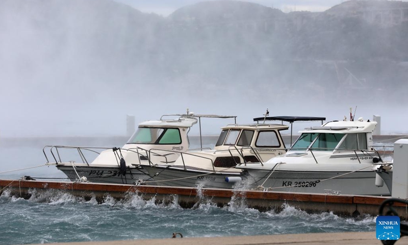 Photo taken on Nov. 22, 2023 shows strong winds moving the sea waves in Bakarac, Croatia. The Croatian Meteorological and Hydrological Service (DHMZ) issued a red alert for heavy rain and strong winds in northern Adriatic.(Photo: Xinhua)