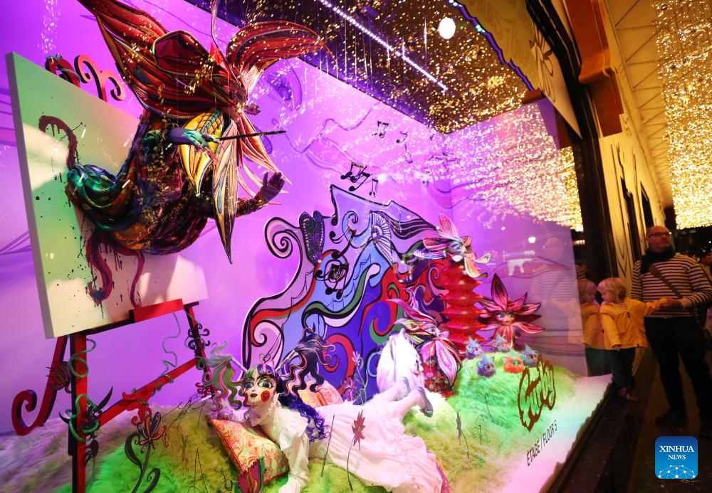 This photo taken on Nov. 21, 2023 shows Christmas window display at the Galeries Lafayette Haussmann department store, in Paris, France. Department stores have unveiled their Christmas window displays for the upcoming festival.(Photo: Xinhua)
