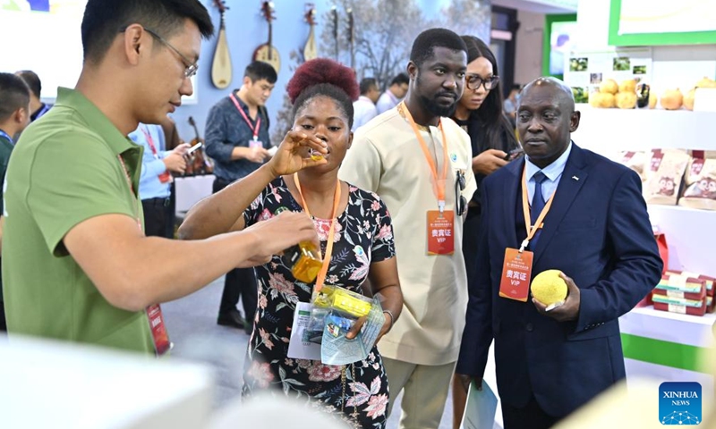 People visit the first World Forestry Industry Conference at Nanning International Convention and Exhibition Center in Nanning, capital of south China's Guangxi Zhuang Autonomous Region, Nov. 25, 2023. The first World Forestry Industry Conference opened in Nanning on Saturday. The event includes a combination of conferences, exhibitions and forums. (Photo: Xinhua)