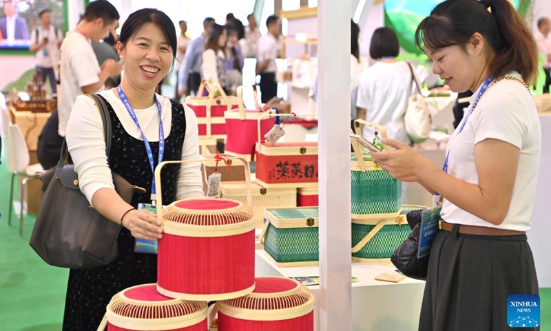 People visit the first World Forestry Industry Conference at Nanning International Convention and Exhibition Center in Nanning, capital of south China's Guangxi Zhuang Autonomous Region, Nov. 25, 2023. The first World Forestry Industry Conference opened in Nanning on Saturday. The event includes a combination of conferences, exhibitions and forums. (Photo: Xinhua)