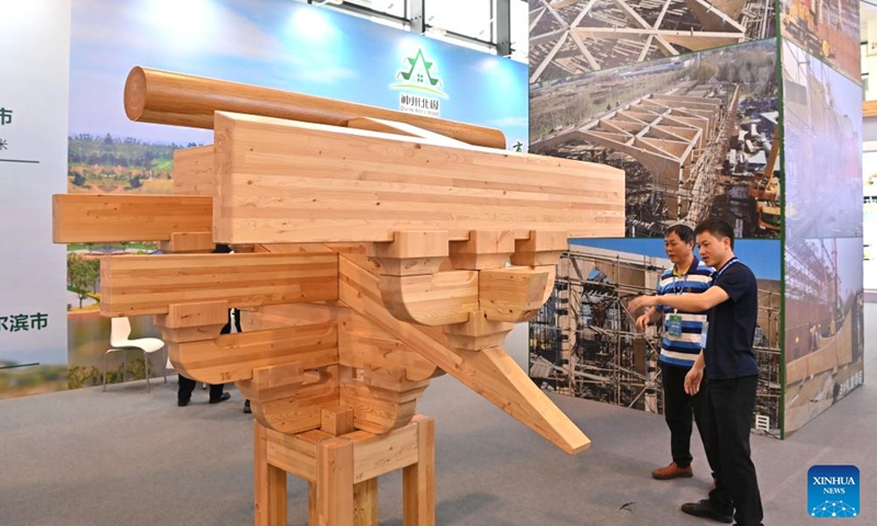 People visit the first World Forestry Industry Conference at Nanning International Convention and Exhibition Center in Nanning, capital of south China's Guangxi Zhuang Autonomous Region, Nov. 25, 2023. The first World Forestry Industry Conference opened in Nanning on Saturday. The event includes a combination of conferences, exhibitions and forums. (Photo: Xinhua)