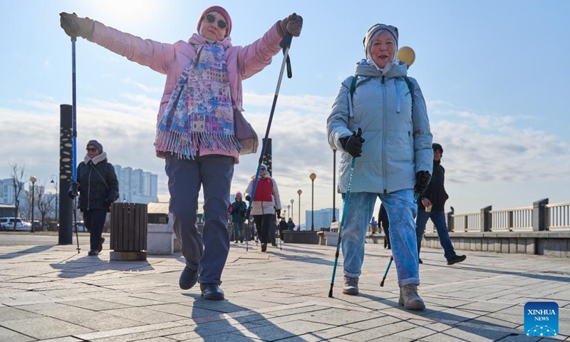 People take part in the Nordic walking race in Vladivostok, Russia, Nov. 26, 2023. A Nordic walking race was held in the Russian Far East city of Vladivostok to commemorate the Mother's Day of the country, which falls on the last Sunday of November. (Photo: Xinhua)