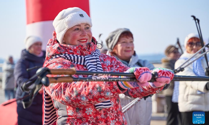 People take part in the Nordic walking race in Vladivostok, Russia, Nov. 26, 2023. A Nordic walking race was held in the Russian Far East city of Vladivostok to commemorate the Mother's Day of the country, which falls on the last Sunday of November. (Photo: Xinhua)