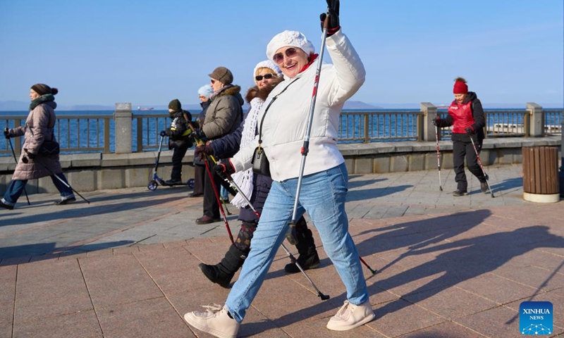 People take part in the Nordic walking race in Vladivostok, Russia, Nov. 26, 2023. A Nordic walking race was held in the Russian Far East city of Vladivostok to commemorate the Mother's Day of the country, which falls on the last Sunday of November. (Photo: Xinhua)