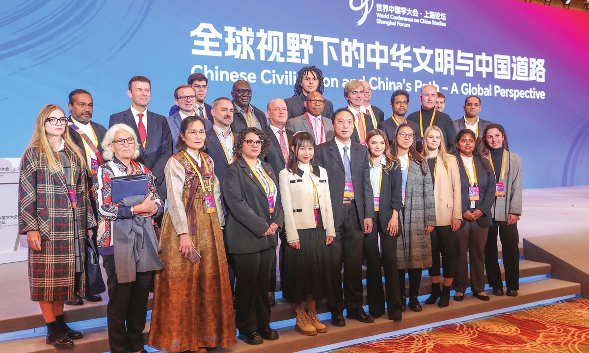Attendees pose for a group photo at the World Conference on China Studies - Shanghai Forum in Shanghai on November 24, 2023. Photo: VCG