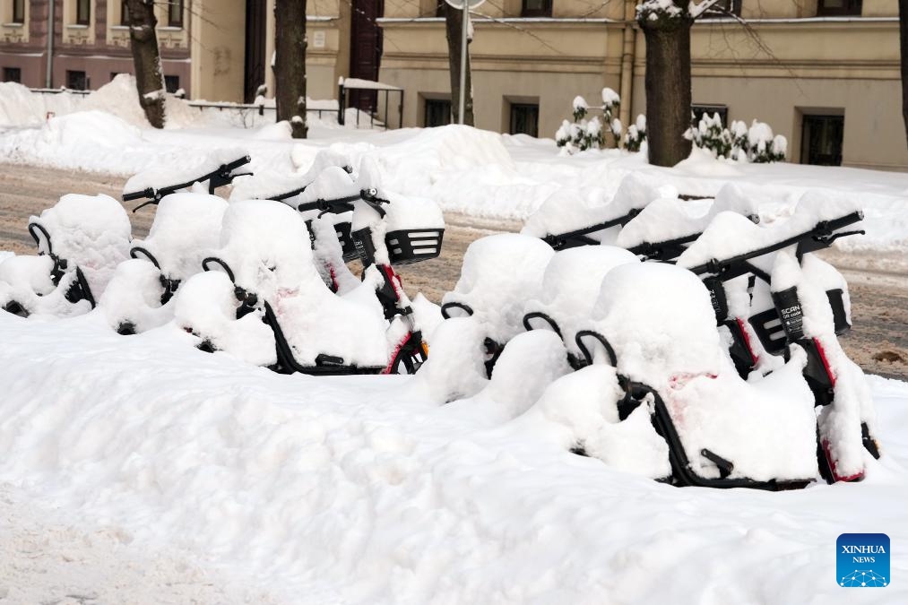 Bicycles covered with snow are pictured in Riga, Latvia, Nov. 30, 2023.(Photo: Xinhua)