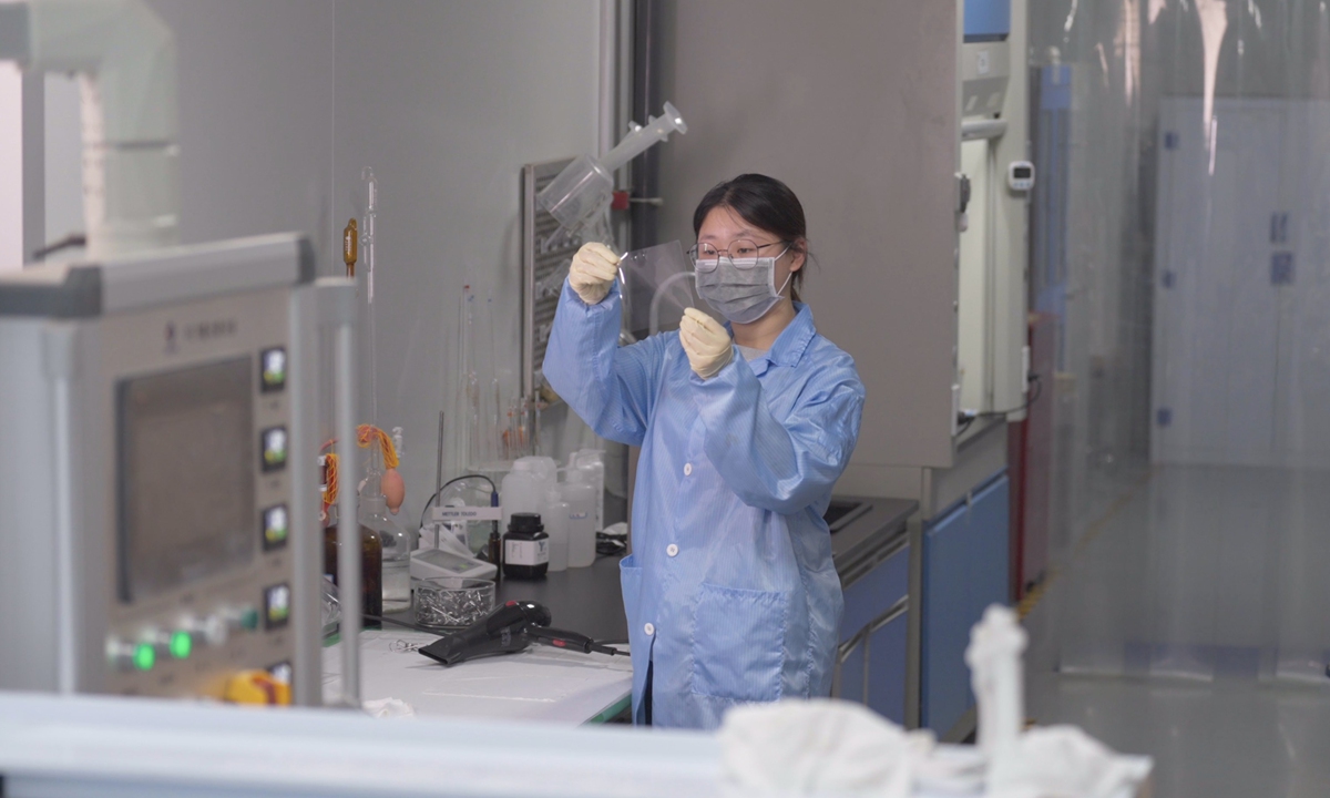 An employee checks a ffexible metal mesh touch sensor at the lab at FlexTouch Technologies Co. in Wuzhen, East China's Zhejiang Province on June 13, 2023. Photo: Pang Yue/GT